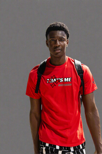 Red That's Not Me Tee on a grey studio background, front, showing the struck-through THAT'S ME star print