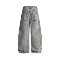 Back view of the washed grey Curved Blade denim jeans showing the twin patch pockets and the curved leg seams