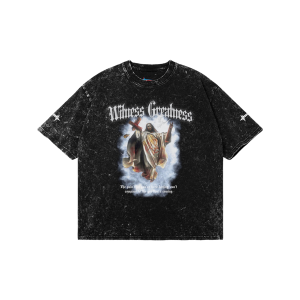 Black acid wash Romans 8:18 Vintage Oversized Tee, front view with blackletter Witness Greatness lettering above a painted graphic of the risen Christ carrying the cross