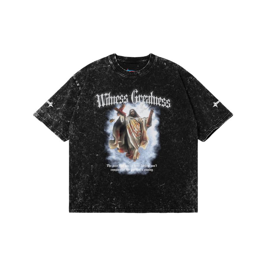 Black acid wash Romans 8:18 Vintage Oversized Tee, front view with blackletter Witness Greatness lettering above a painted graphic of the risen Christ carrying the cross